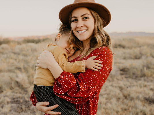 Skylar with her little girl in a field