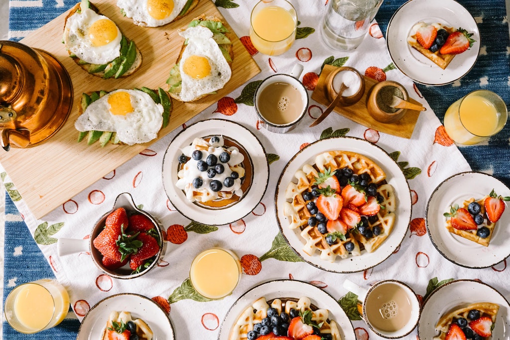 a table full of fresh breakfast foods