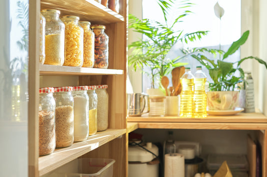 sunlit wooden pantry with dried goods and plants